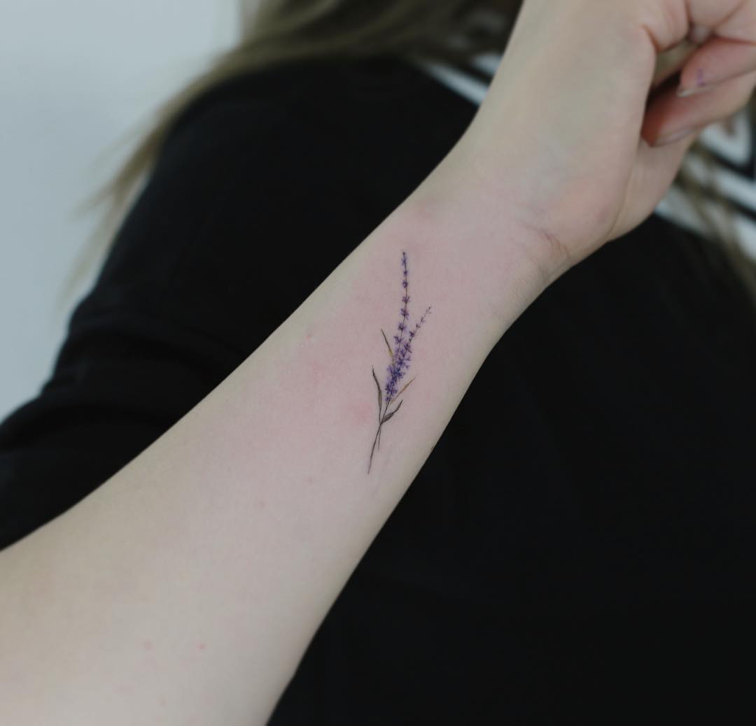 Delicate lavender tattoo on the forearm