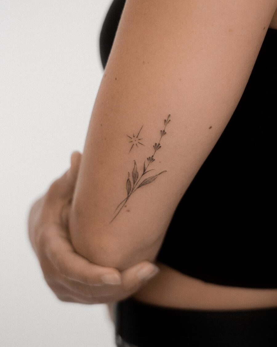 Elegant lavender tattoo with a delicate star.