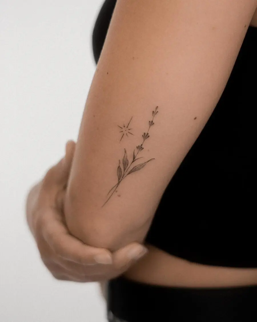 Elegant lavender tattoo with a delicate star.