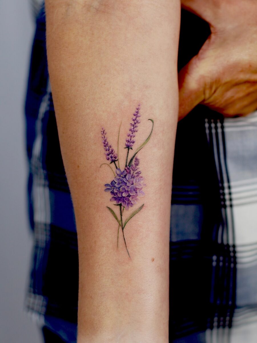 Delicate lavender tattoo showcasing floral artistry