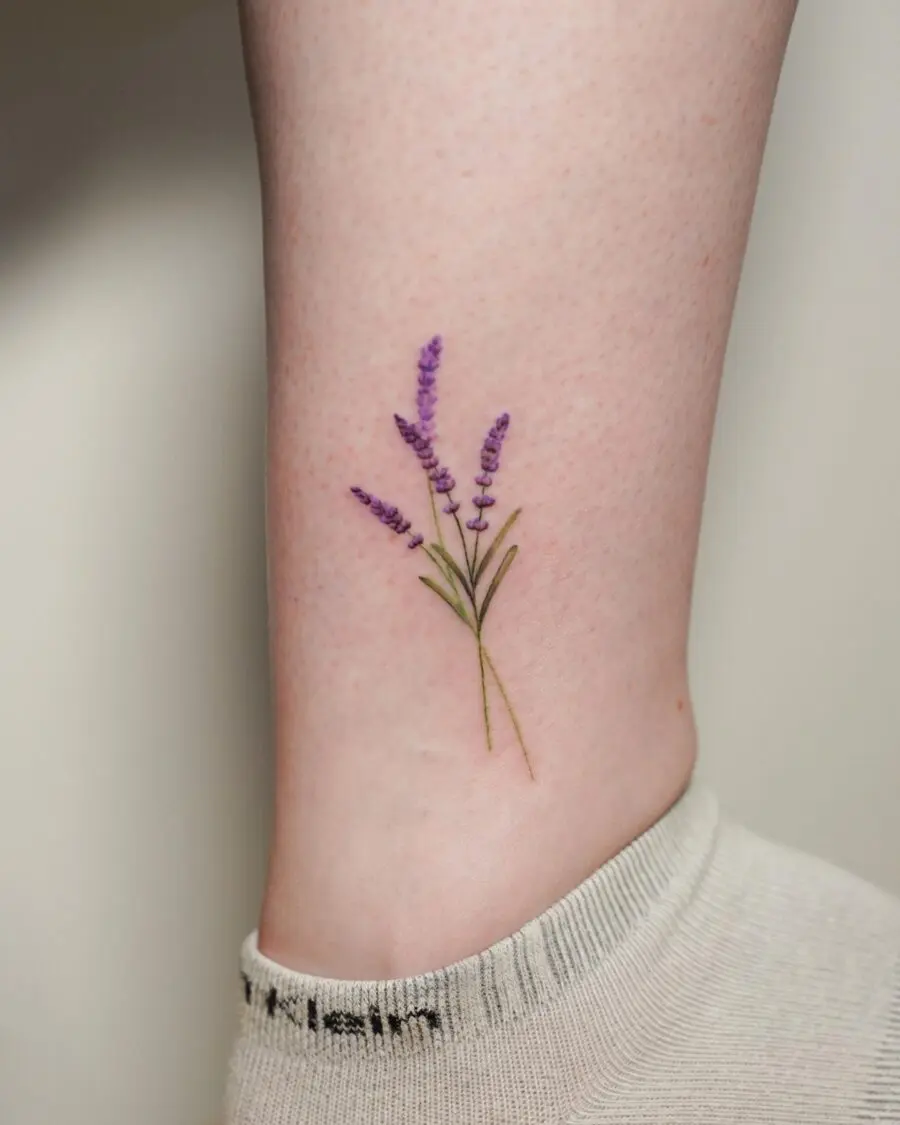 Elegant lavender tattoo on ankle.