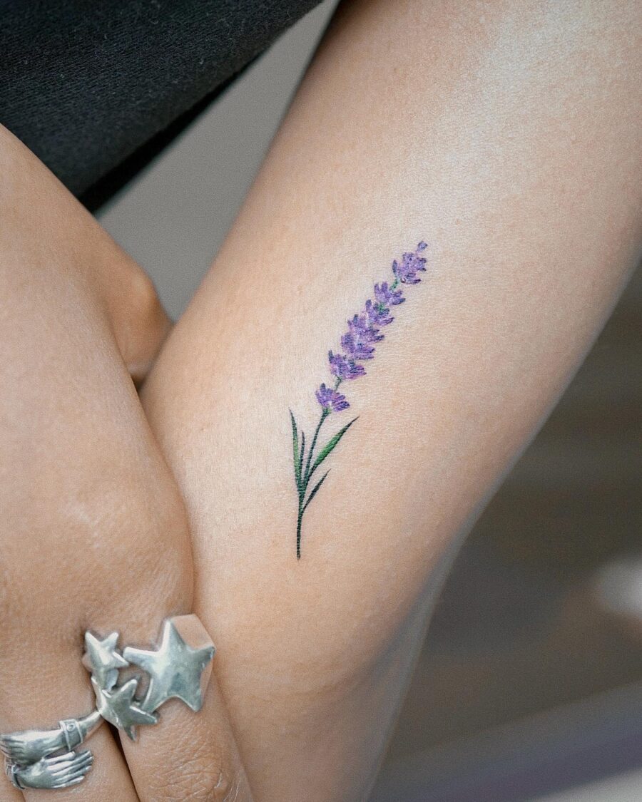 Delicate lavender tattoo showcasing minimalist beauty