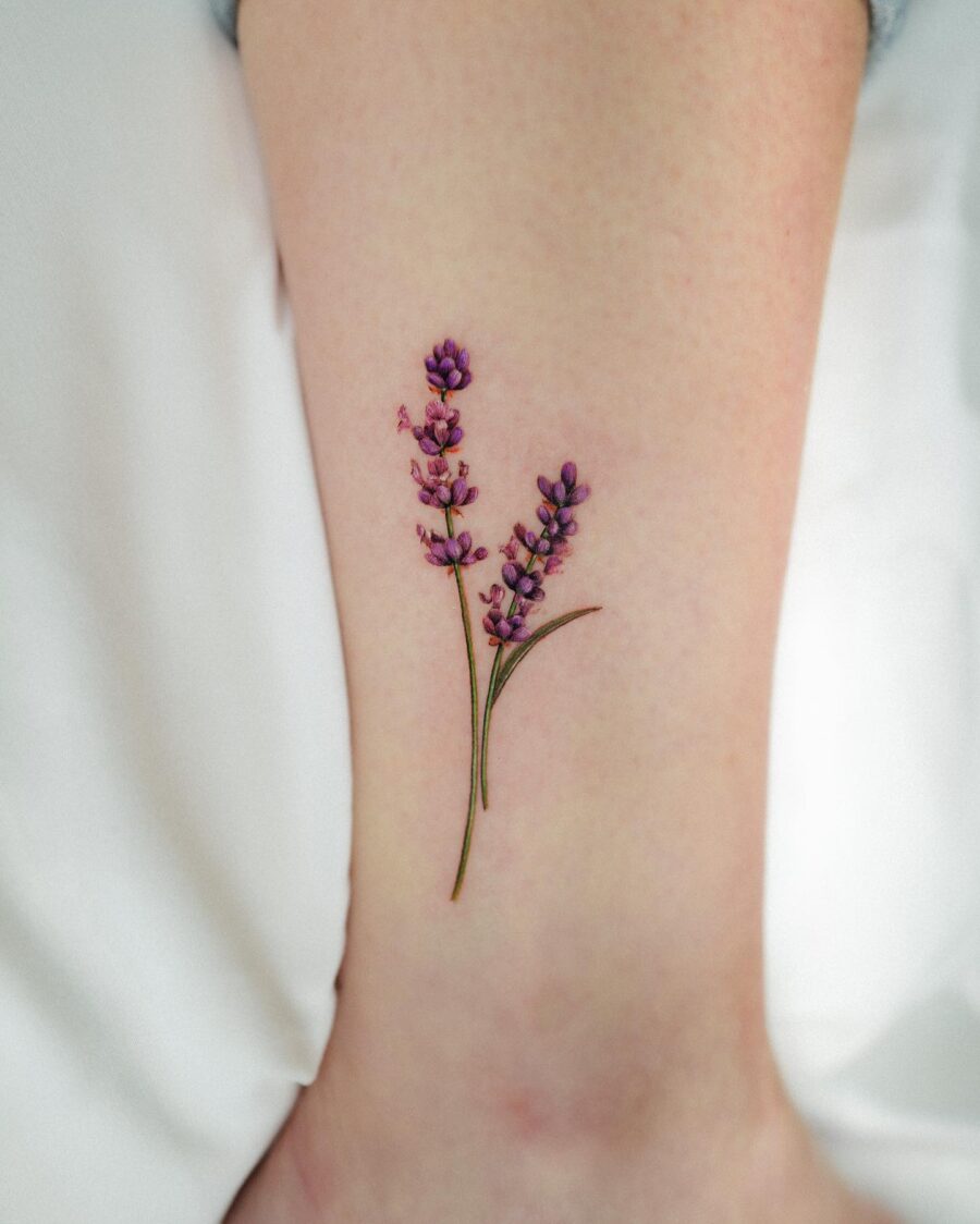 Delicate lavender tattoo on the leg