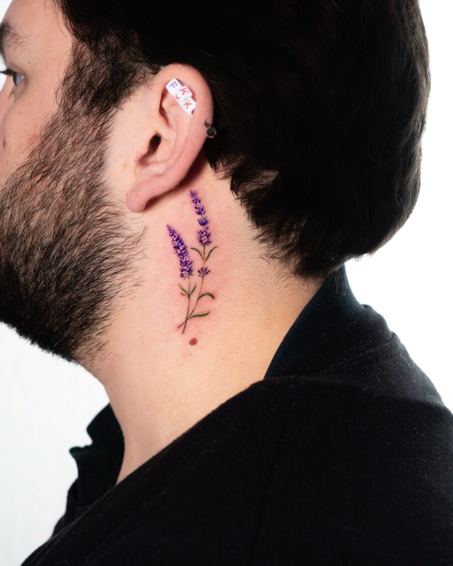 Elegant lavender tattoo on the side of the neck