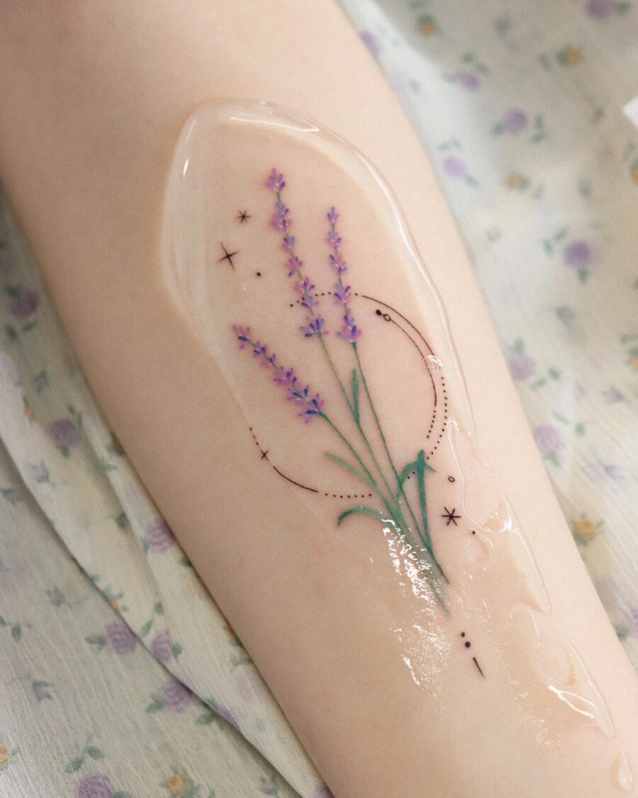 Delicate lavender tattoo with celestial accents