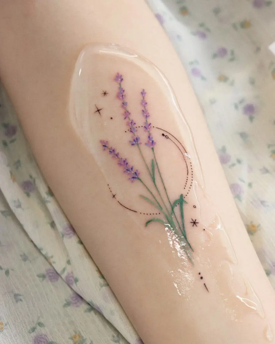 Delicate lavender tattoo with celestial accents