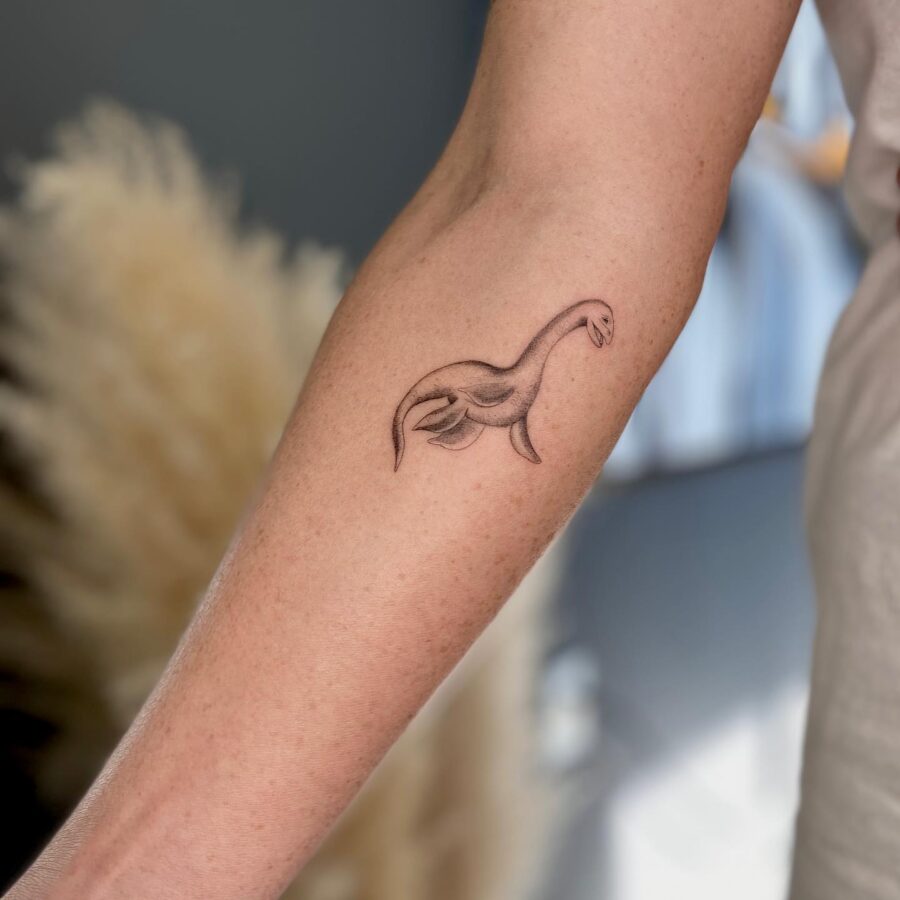 Stylish Loch Ness Monster Arm Tattoo Design