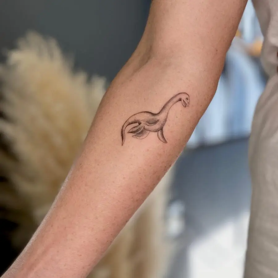 Stylish Loch Ness Monster Arm Tattoo Design