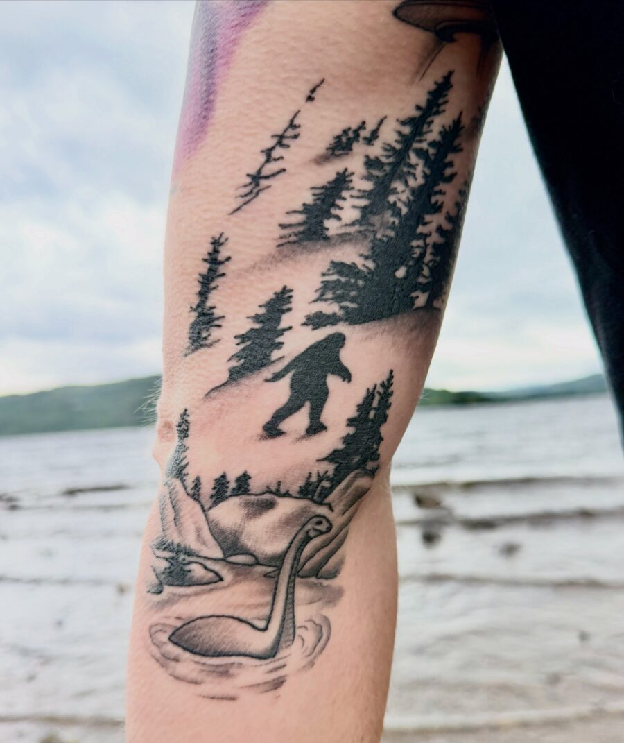 Intricate Loch Ness Monster Tattoo with Forest Scene