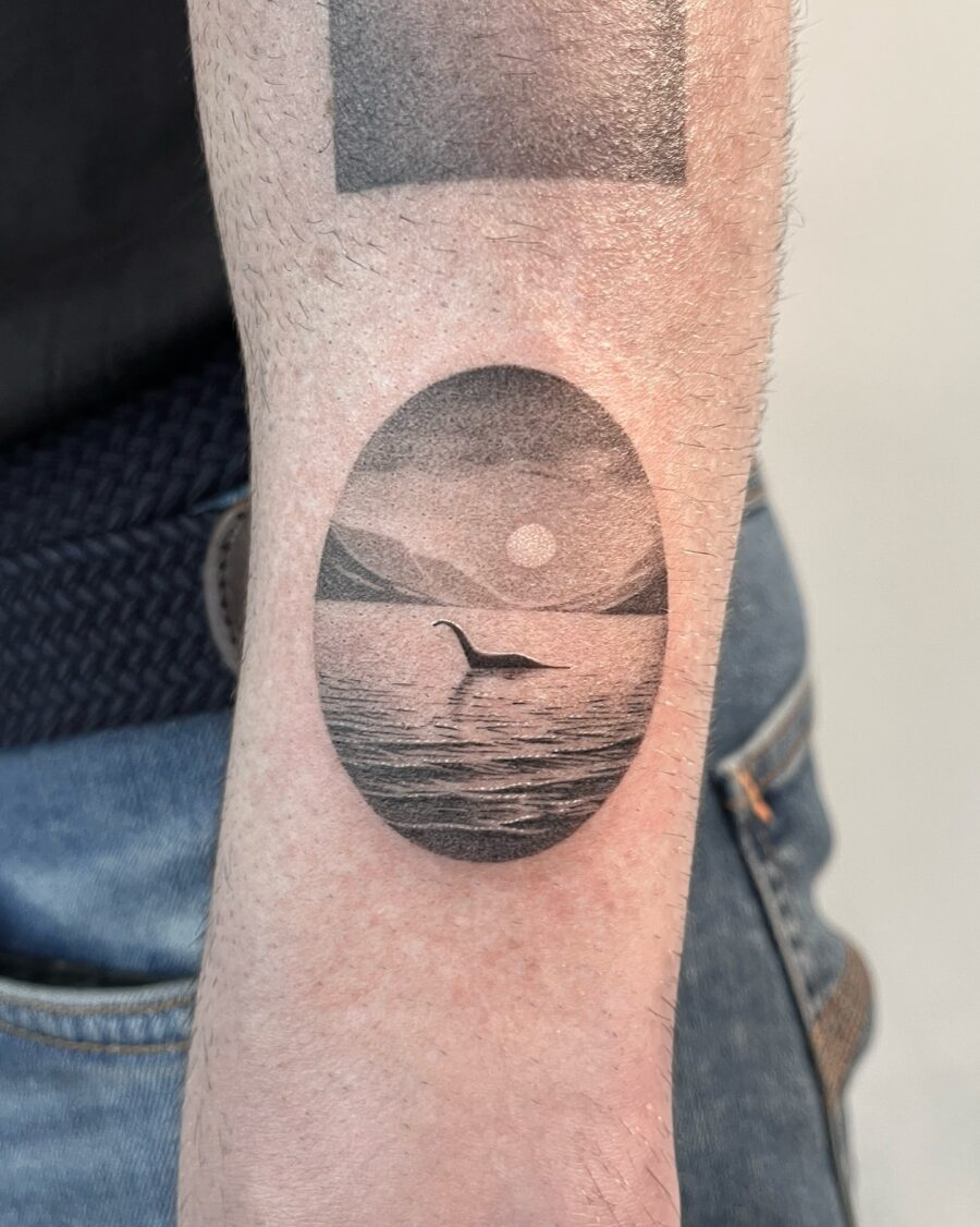 Elegant loch ness monster tattoo in serene setting