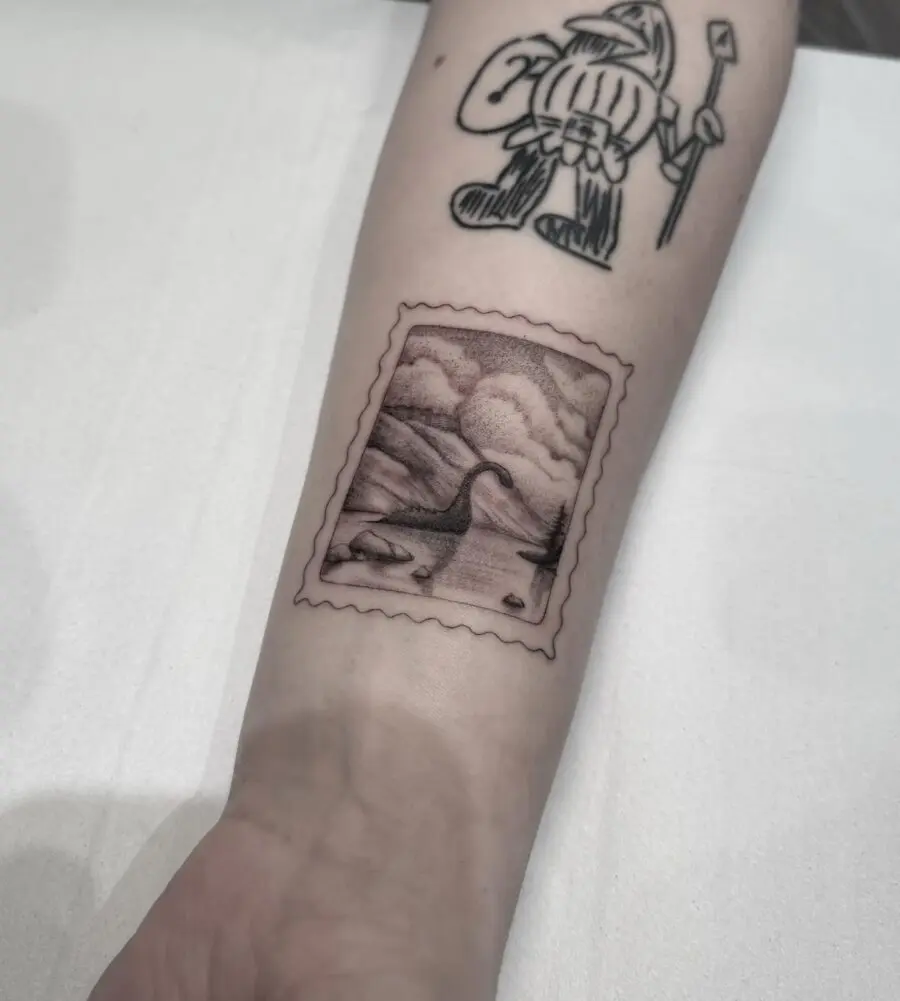 Intricate stamp-style Loch Ness monster tattoo