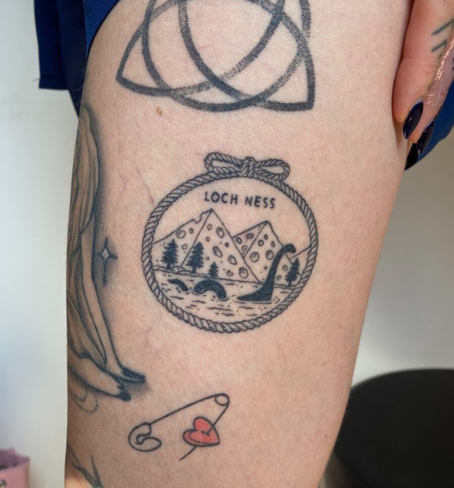 Charming Loch Ness Tattoo with Scenic Elements