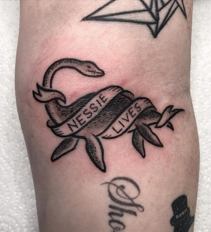 Whimsical Nessie tattoo with inspirational text