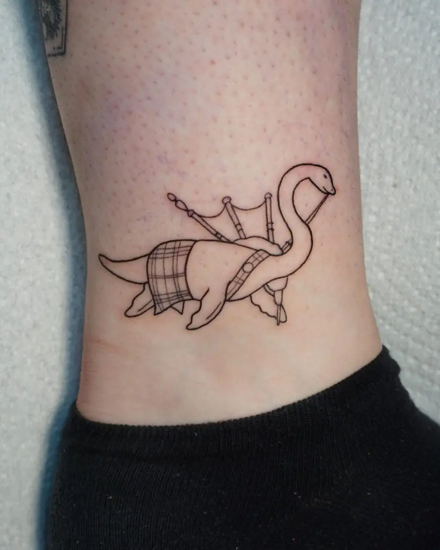 Charming Loch Ness Monster Tattoo with Bagpipes