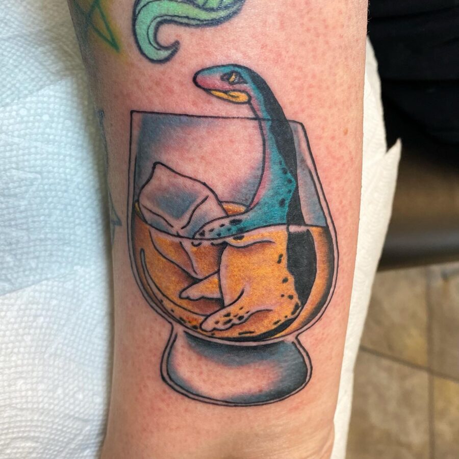 Whimsical Loch Ness Monster Tattoo in Glass