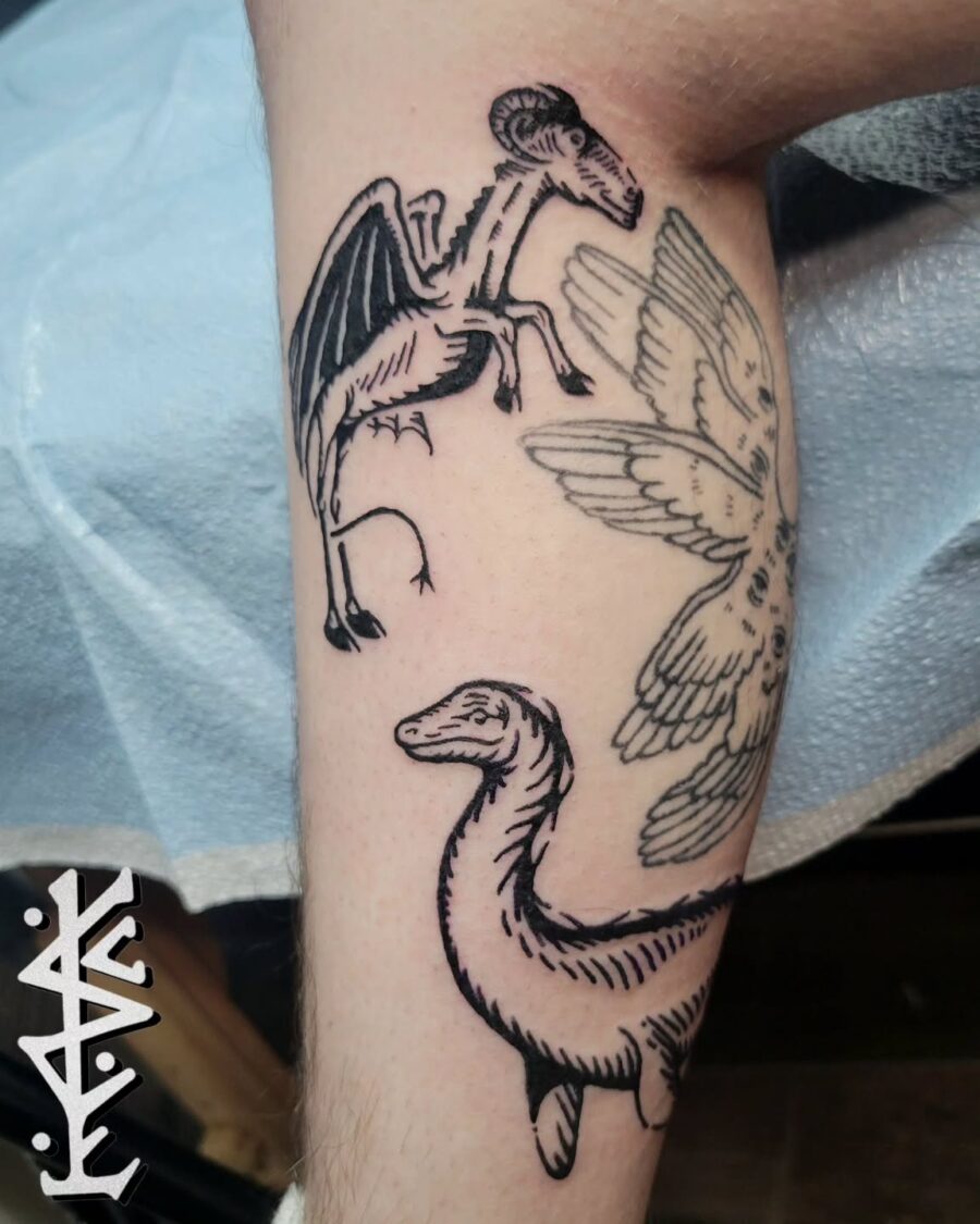 Unique Loch Ness Monster and Winged Creatures Tattoo