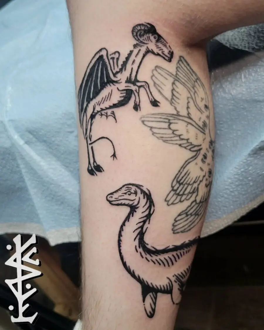 Unique Loch Ness Monster and Winged Creatures Tattoo