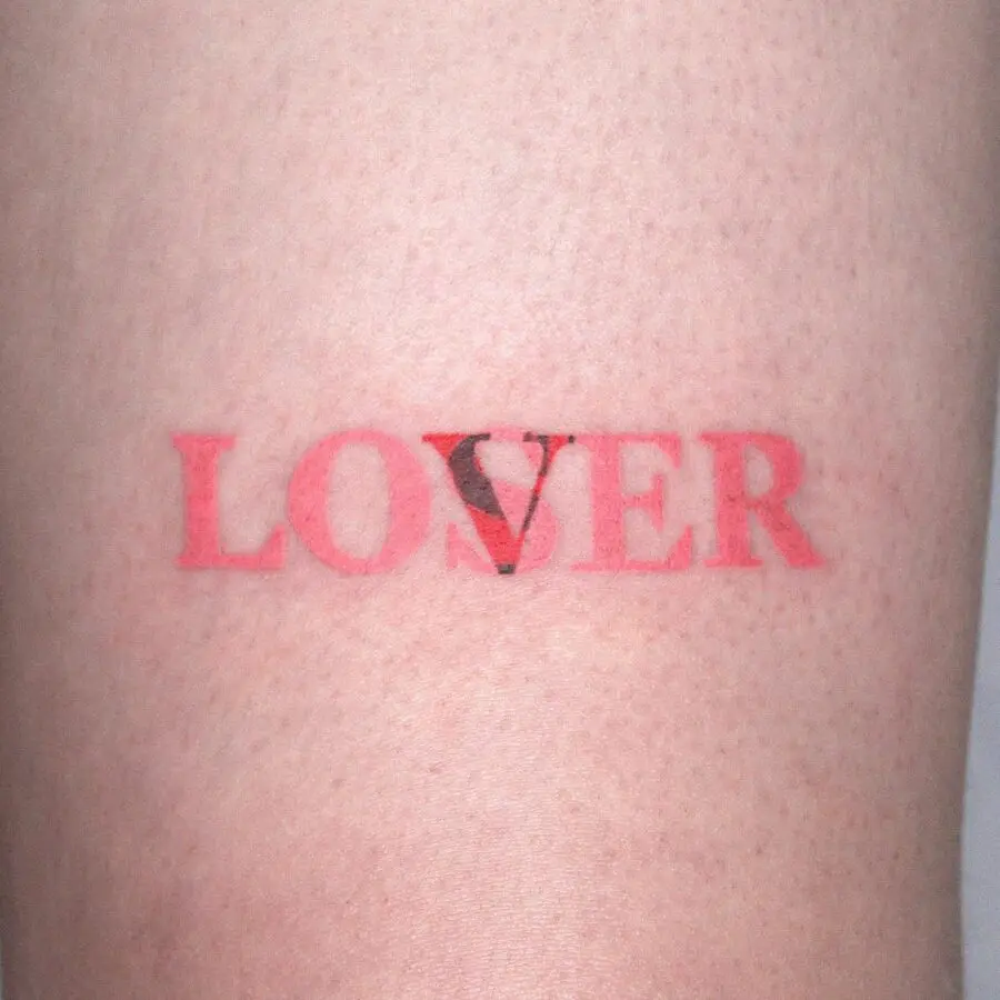 Stylish one-word tattoo of 'LOVER'