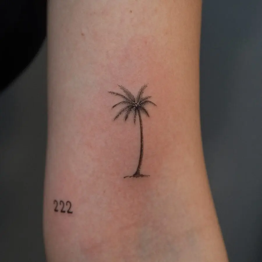 Elegant minimalist palm tree tattoo design