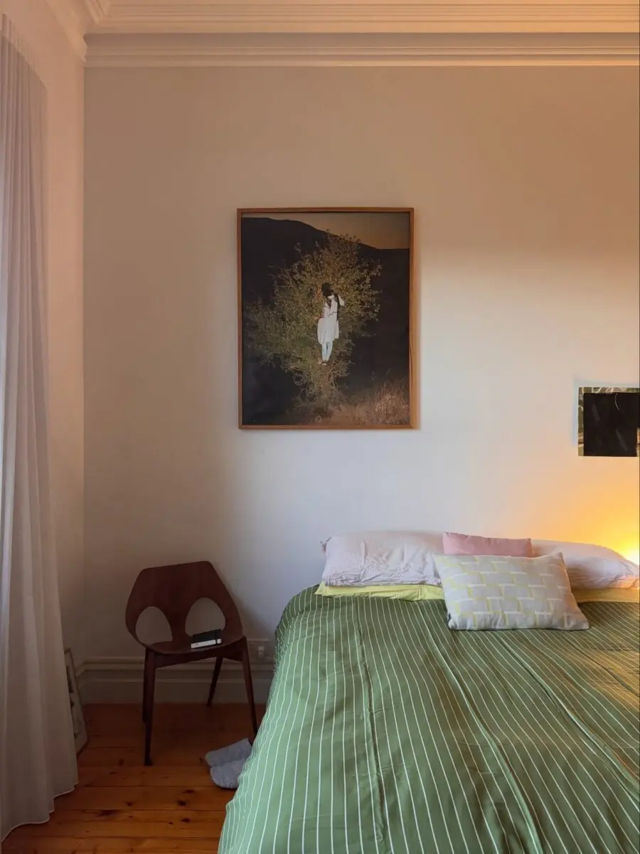 Serene bedroom with nature-inspired artwork
