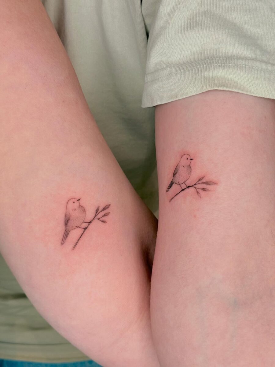 Bird tattoos symbolizing mother-son bond