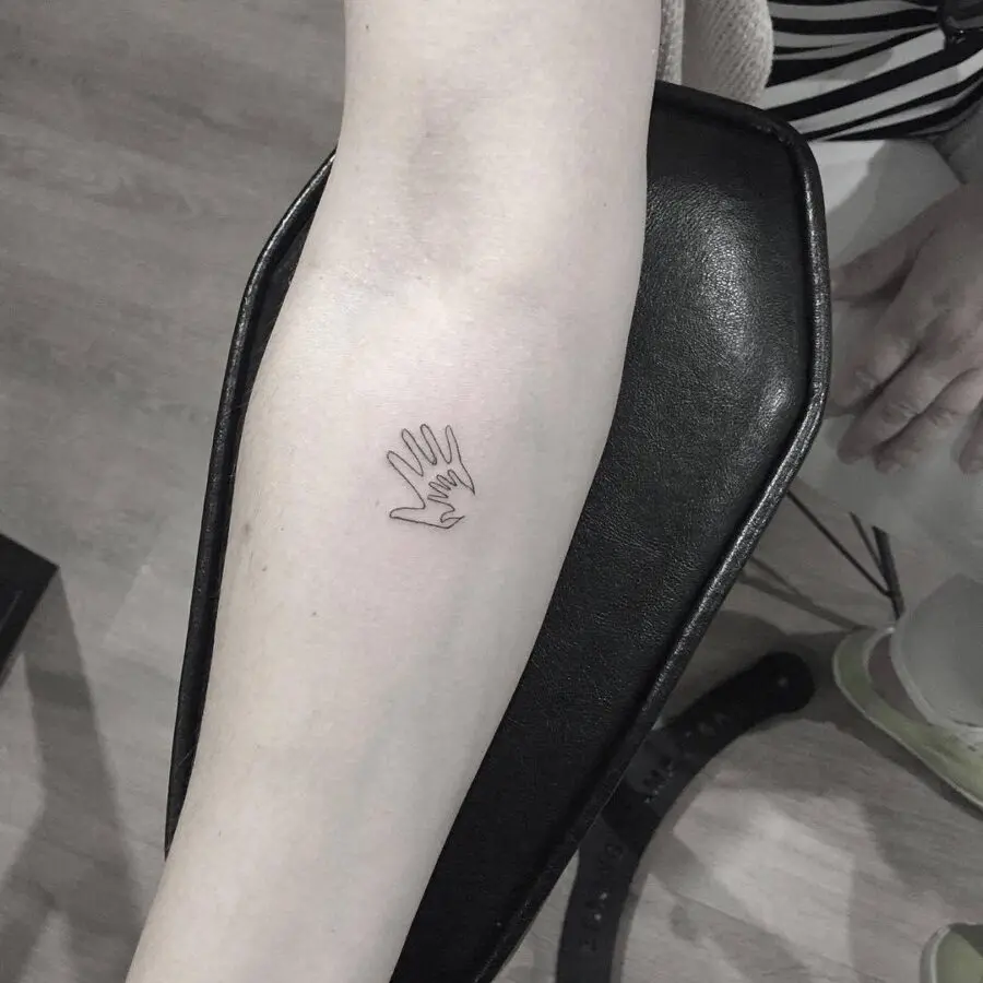 Minimalist Mother-Son Hand Tattoo Design
