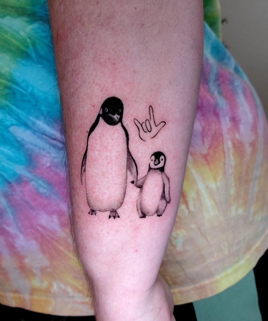 Adorable mother-son penguin tattoo bond