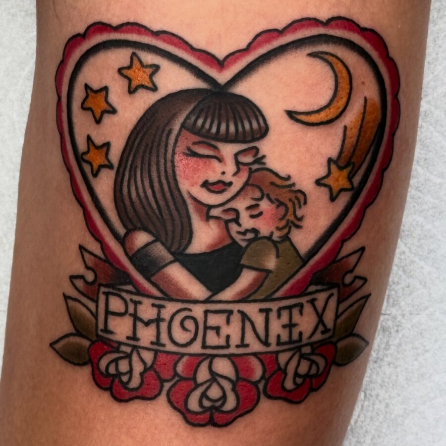 Heartwarming mother-son tattoo with a phoenix theme