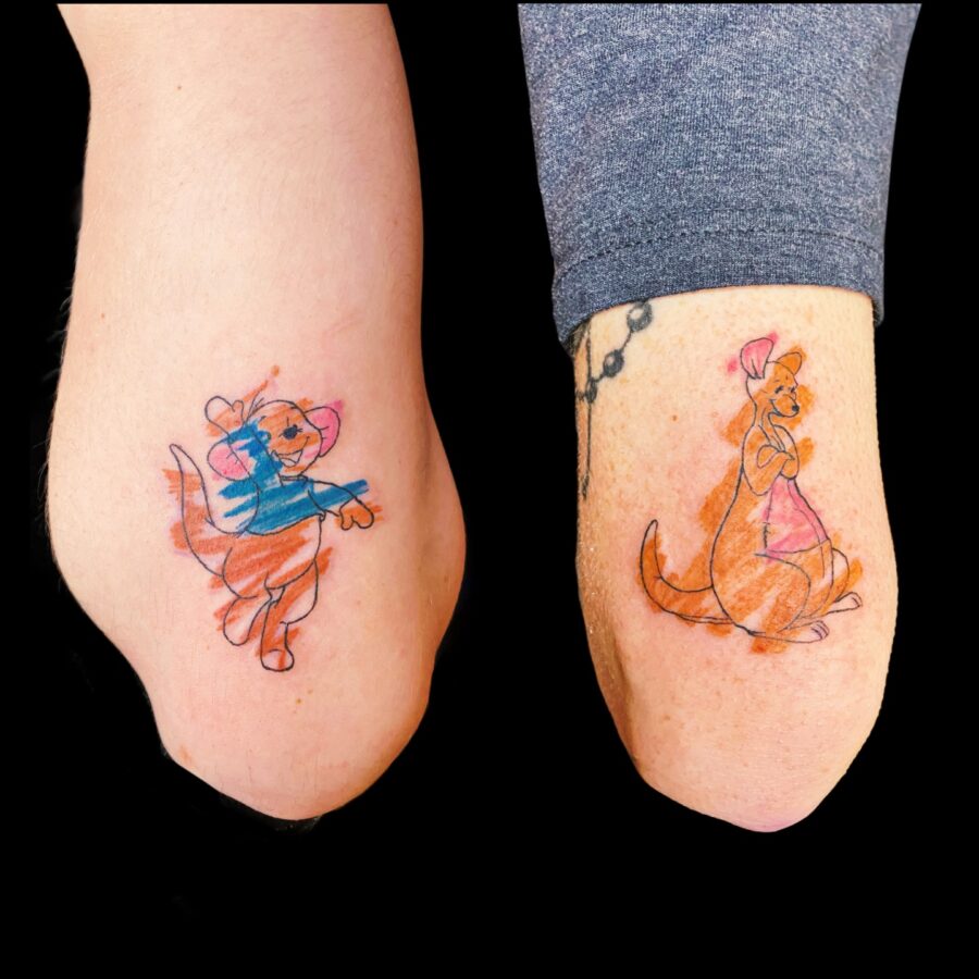 Playful mother-son tattoo duo featuring animated characters
