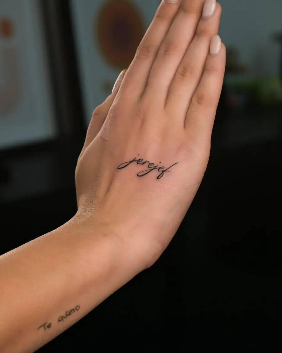Elegant and minimalist one-word tattoos on hand
