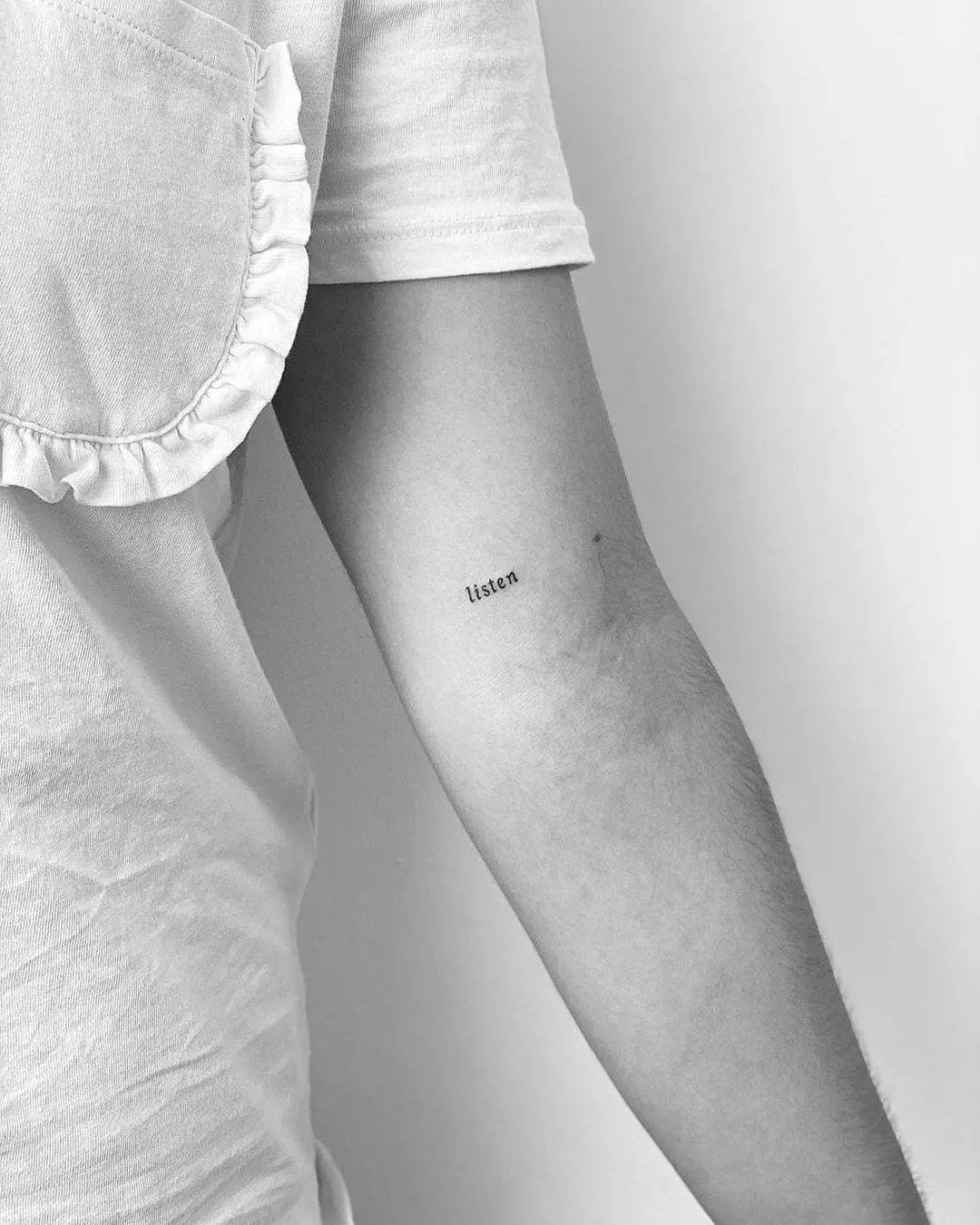 Expressive one-word tattoo: Listen