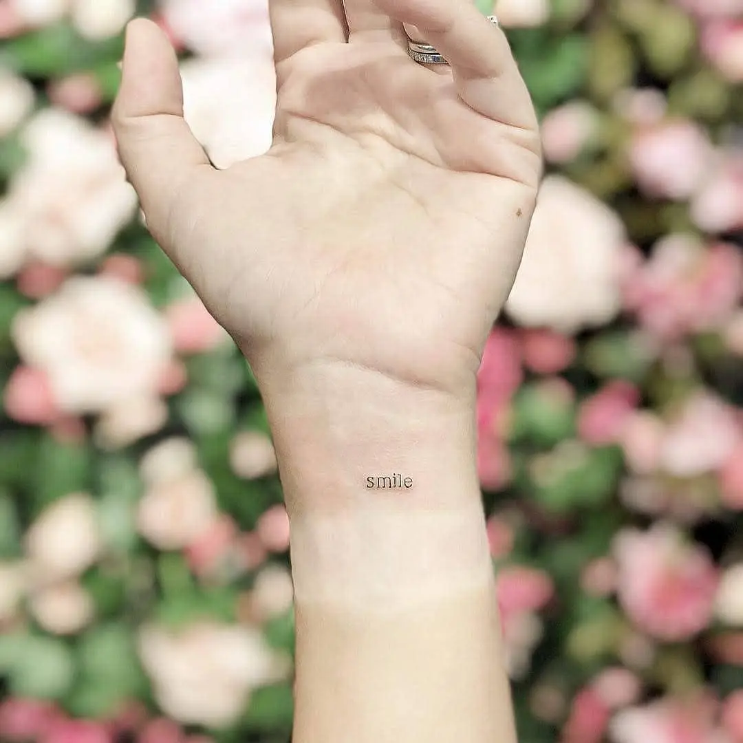 Minimalist tattoo with a positive message