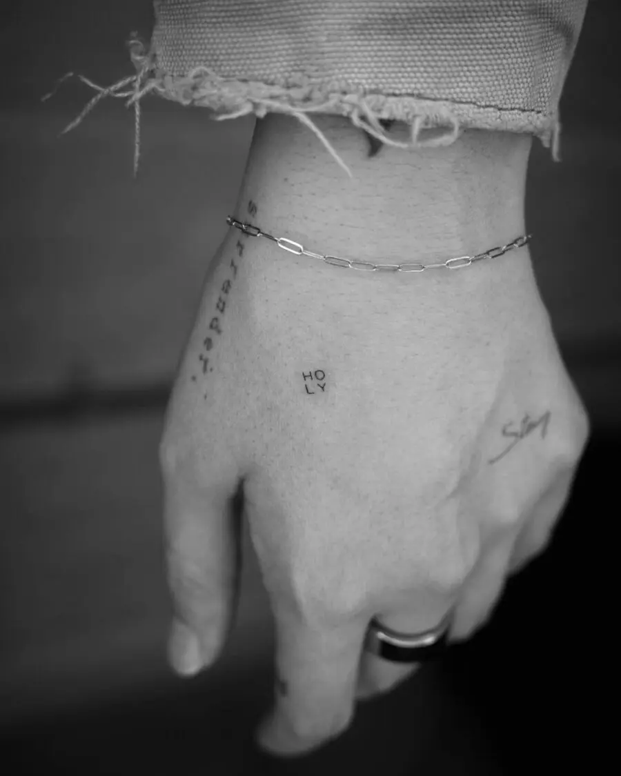 Elegant one-word tattoo in minimal style