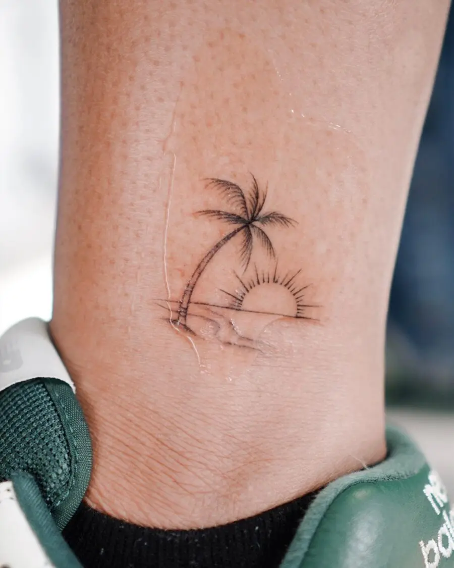 Charming palm tree tattoo with sunset vibes