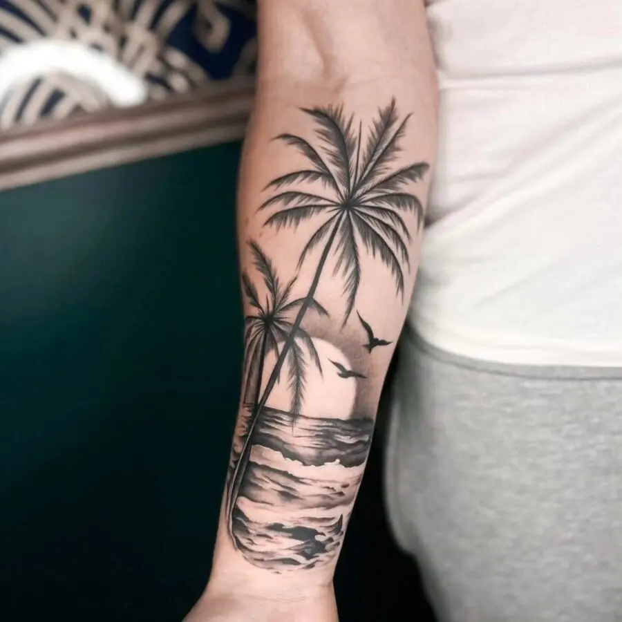 Stunning palm tree tattoo with ocean backdrop