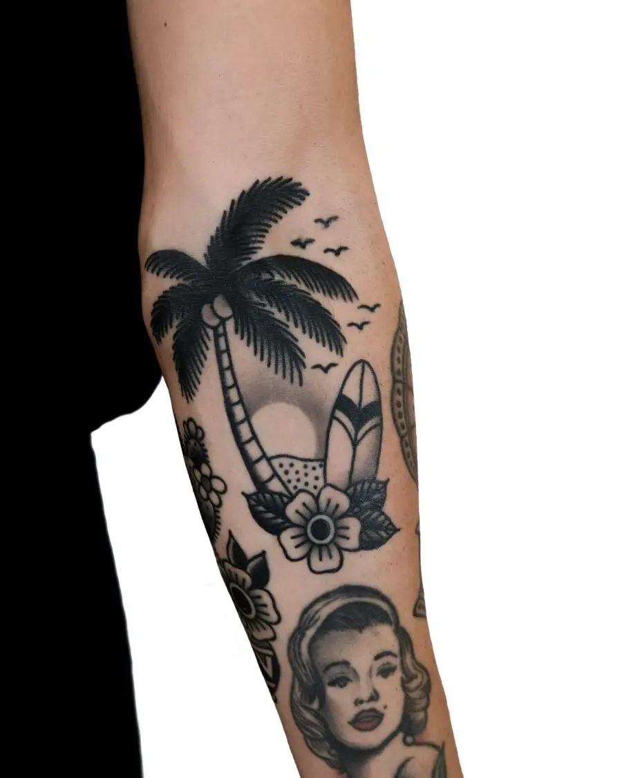 Cool palm tree tattoo with surfboard vibes