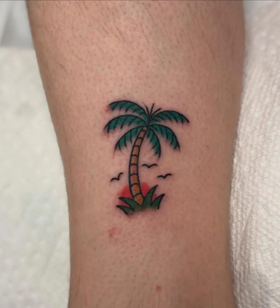 Vibrant Palm Tree Tattoo with Nature Elements