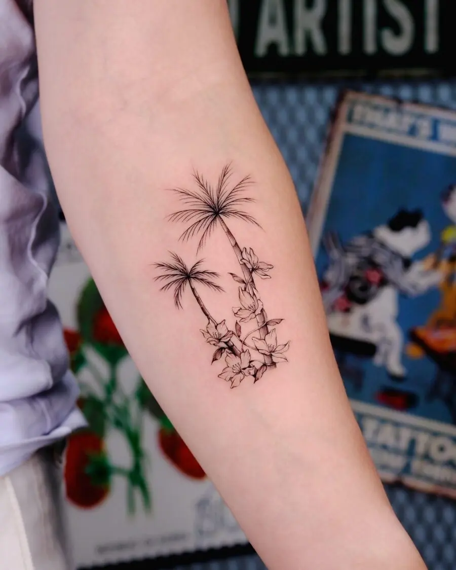 Elegant palm tree and floral tattoo design