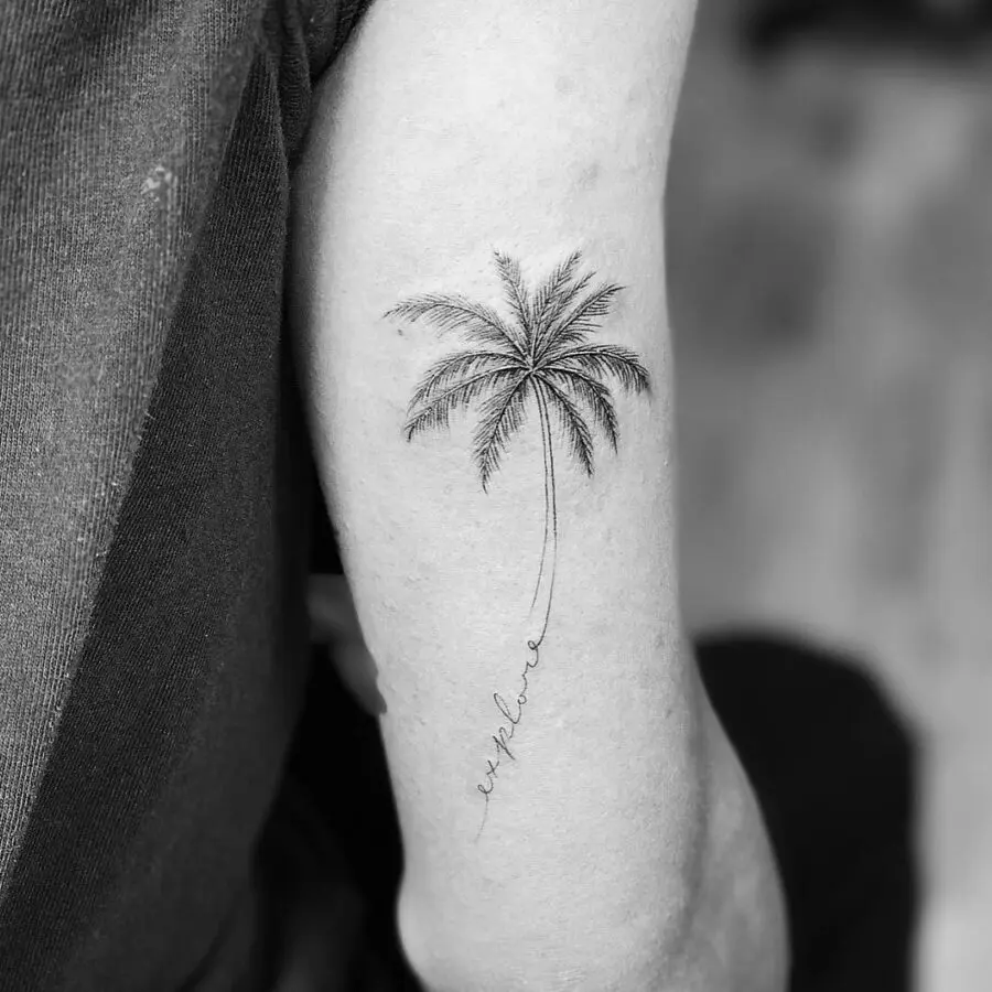 Elegant minimalist palm tree tattoo design