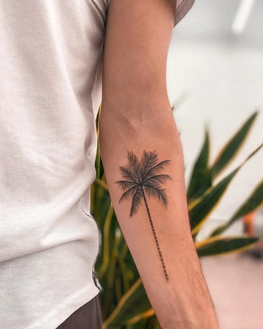 Chic minimalism shines in this palm tree tattoo