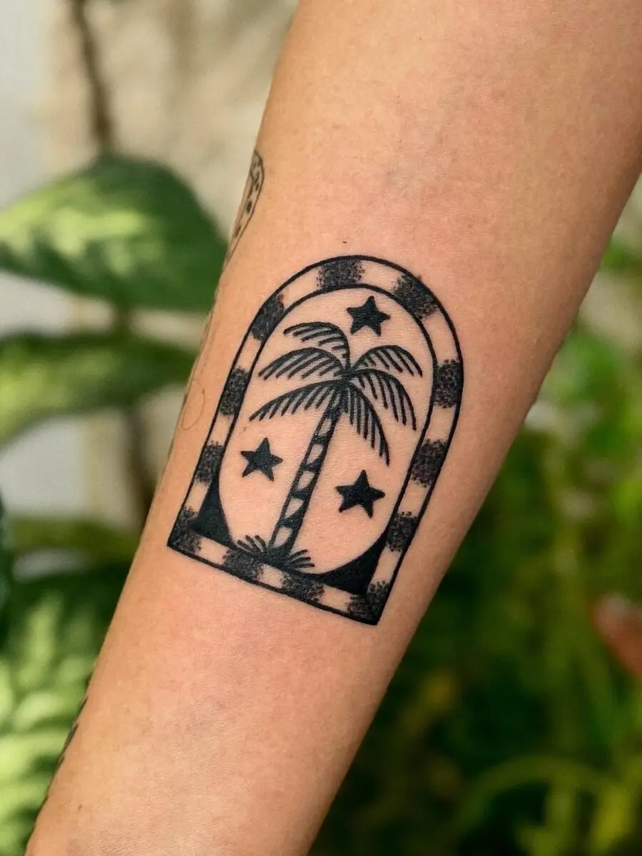 Minimalistic palm tree tattoo with stars