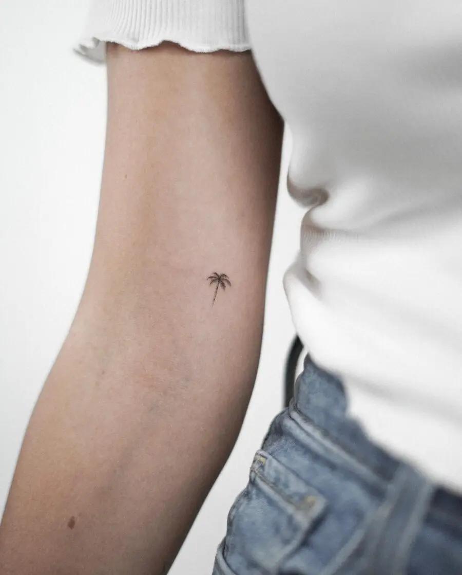 Delicate palm tree design on the arm