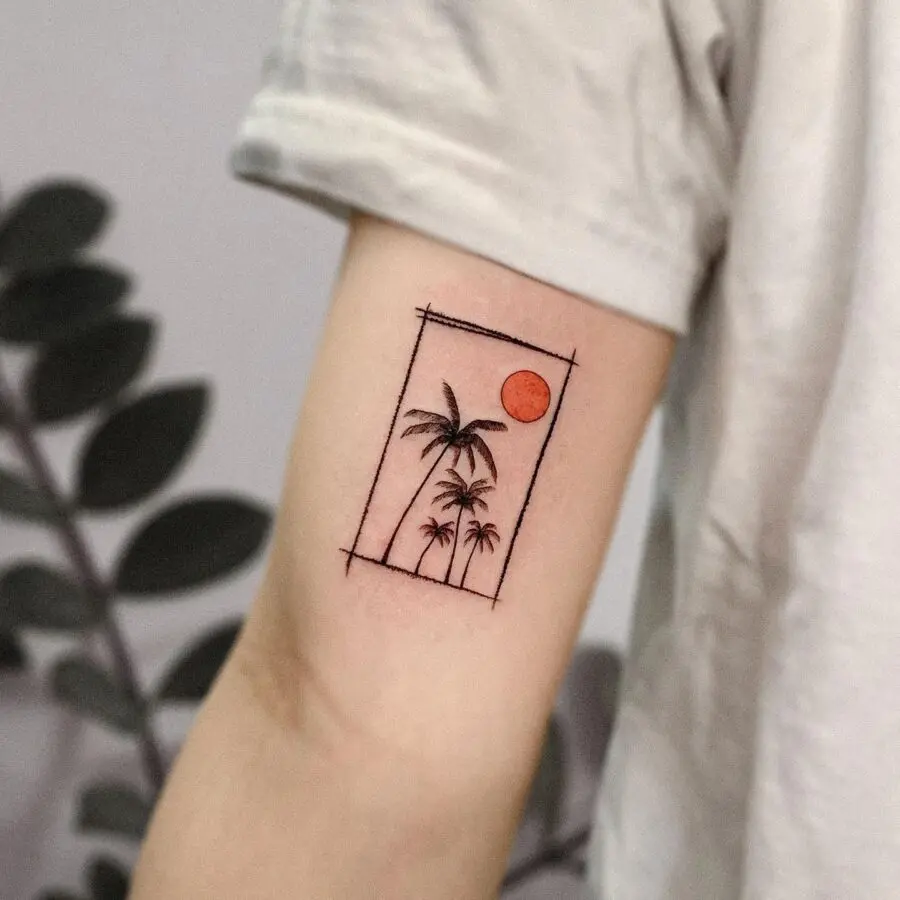 Minimalist palm tree tattoo with sunset vibes