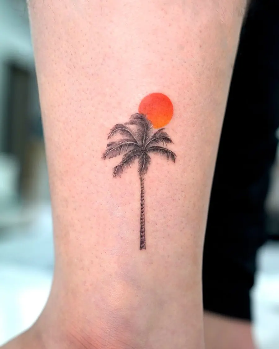 Stunning minimalist palm tree tattoo with sunset