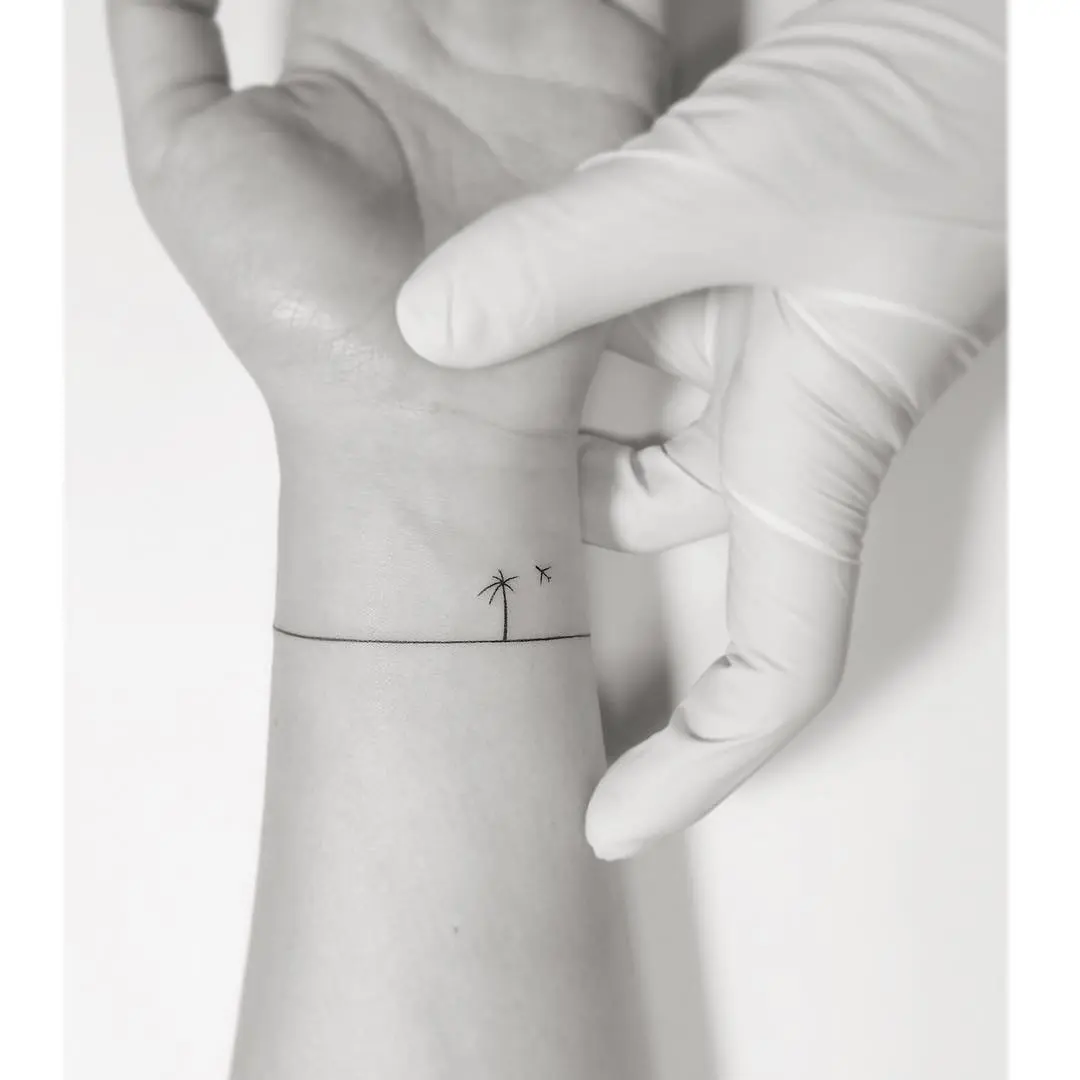 Minimalist Palm Tree Tattoo on the Wrist