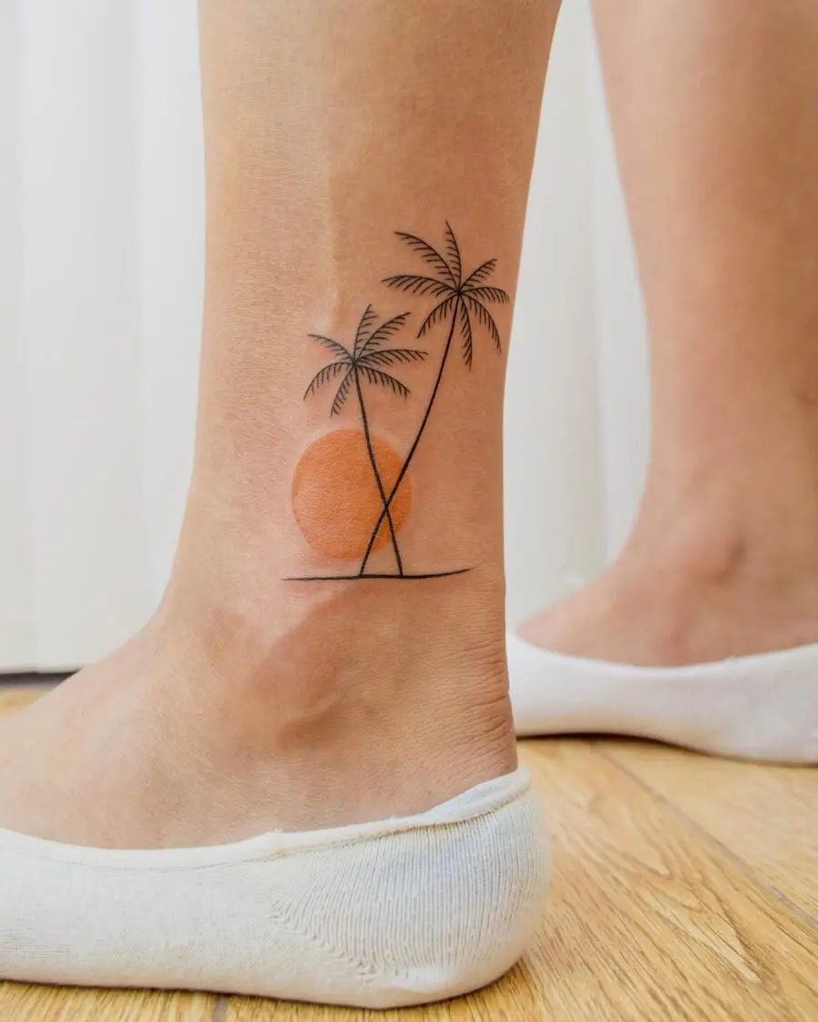 Charming palm tree tattoo with sunset vibe