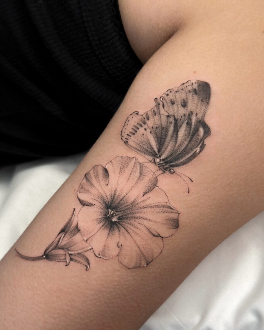 Elegant petunia and butterfly tattoo design