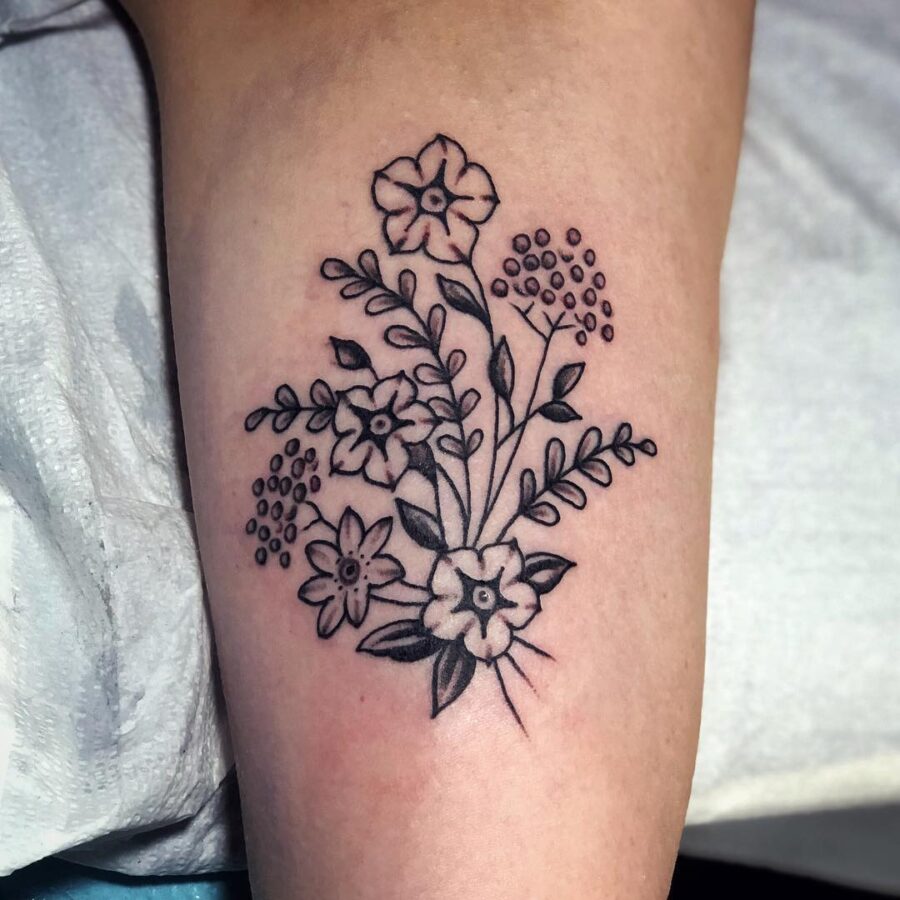 Elegant black line petunia tattoo design
