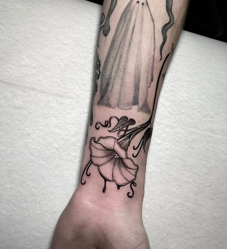Elegant petunia tattoo with a minimalist touch