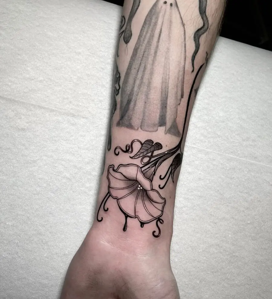 Elegant petunia tattoo with a minimalist touch